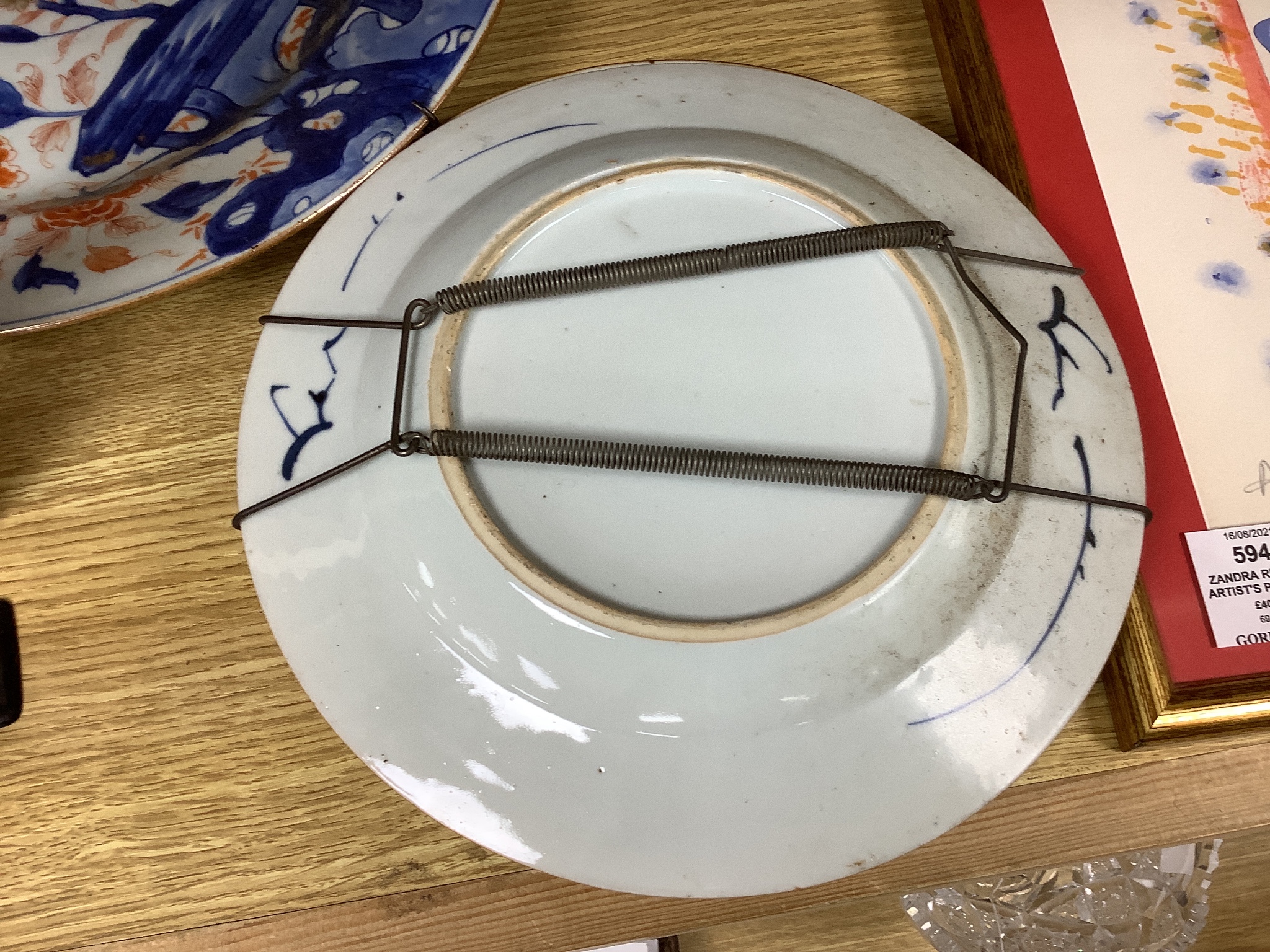 Three Japanese Imari plates together with a larger dish, 18th century, diameter 32cm